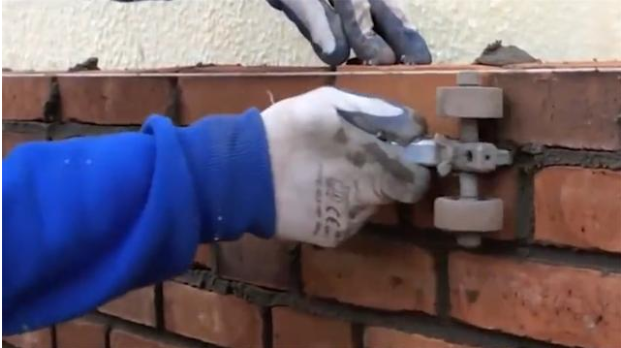 Roller for shaping grout during masonry