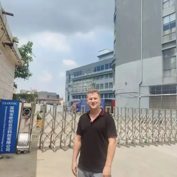 Josip in front of a factory in China